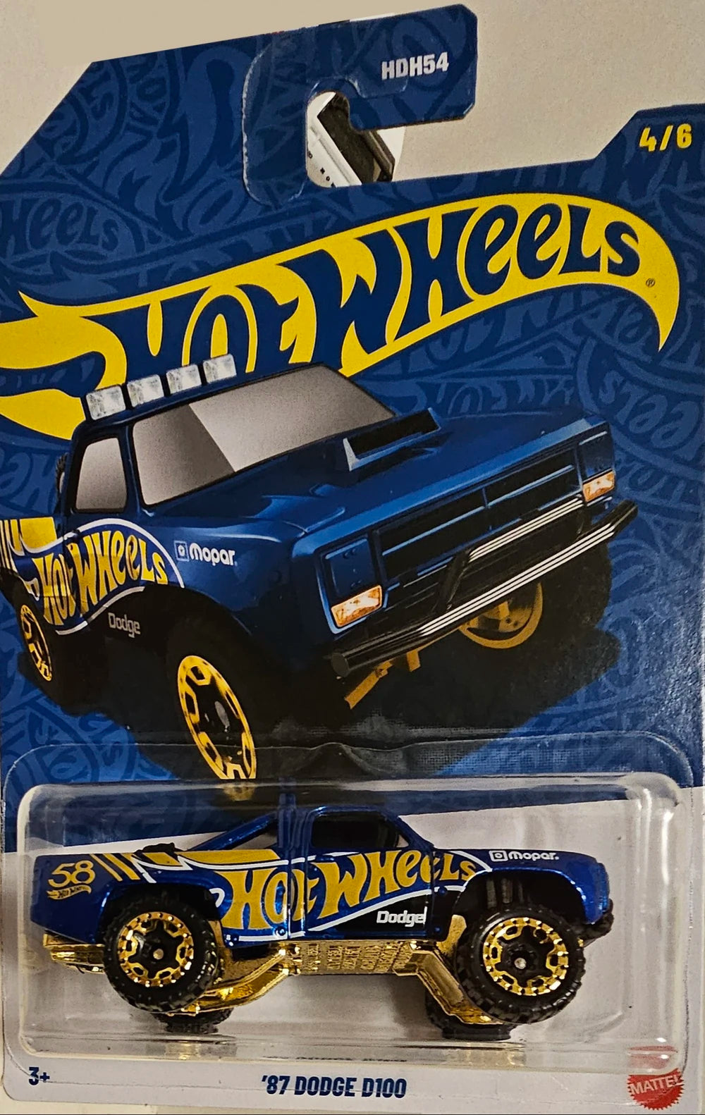 Hot Wheels 2026 58th Anniversary Mix A, 4/6 '87 Dodge D100, blue and gold