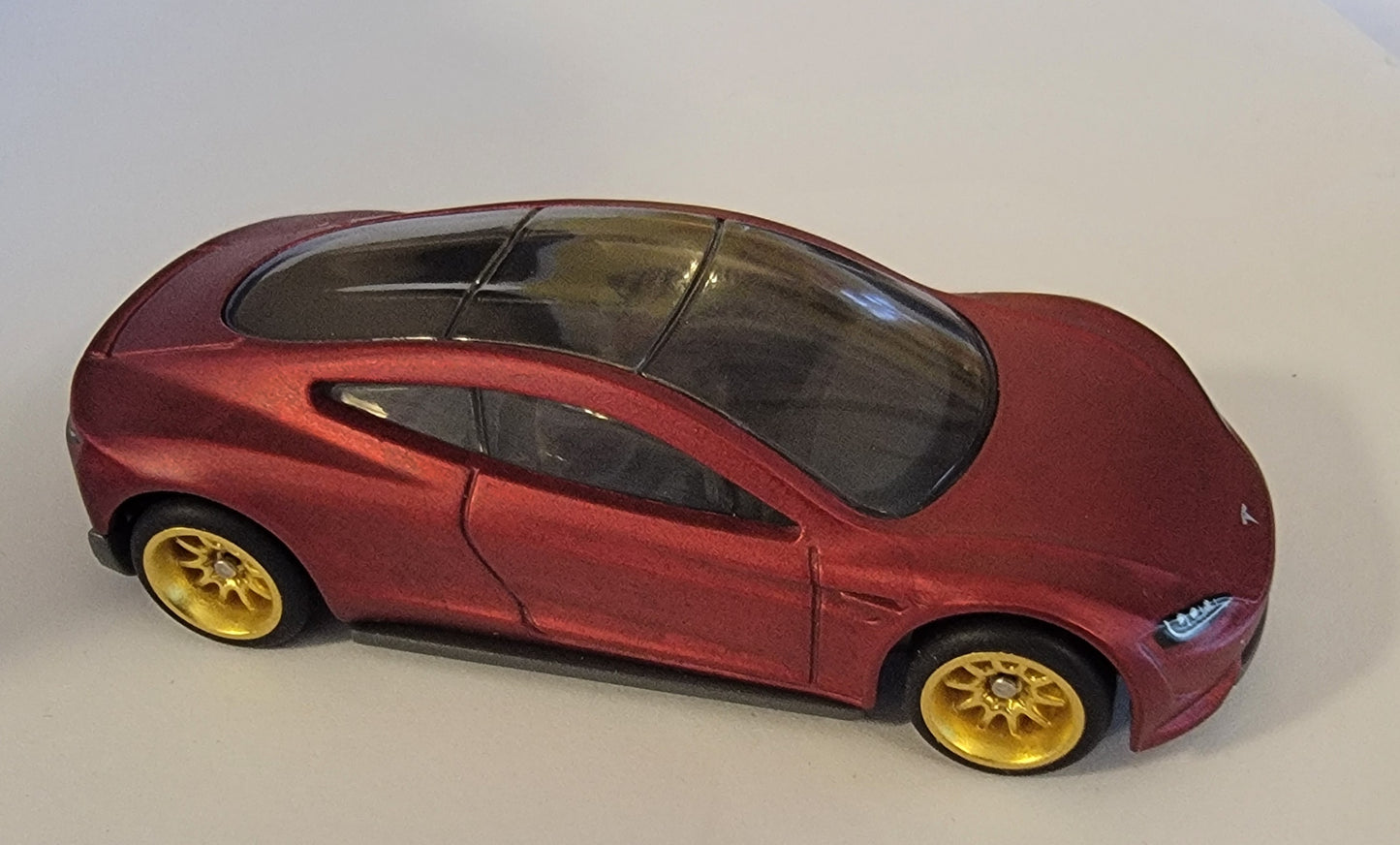 Matchbox 2021 #004/100 2020 Tesla Roadster, matte metalflake dark red - WHEEL SWAPPED with rubber tires