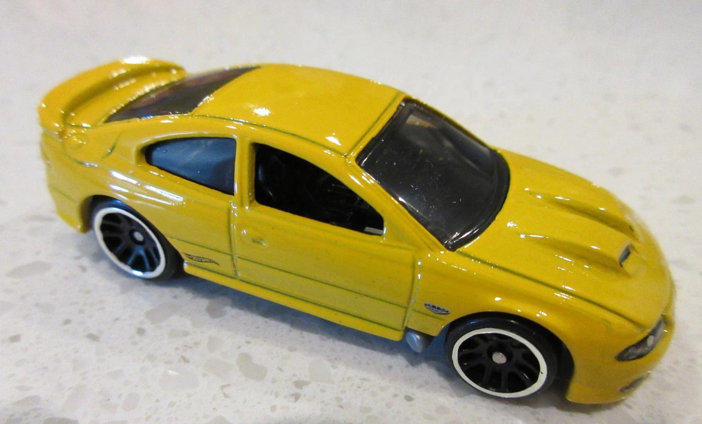 Hot Wheels 2026 Pontiac 100th Anniversary 2/5, '06 Pontiac GTO, NEW/LOOSE, yellow jacket