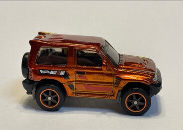 Hot Wheels 2024 #169/250 Pajero Evolution, SUPER TREASURE HUNT, NEW/LOOSE, burnt orange (Copy)