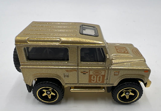 Hot Wheels 2022 FAO Schwarz Multipack Land Rover Defender 90, NEW/LOOSE, gold